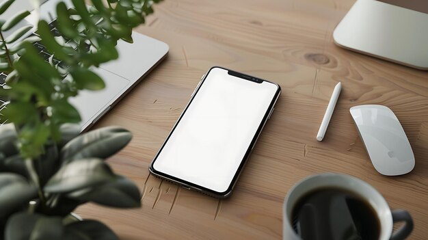 Foto vista superior de uma mesa com um laptop um smartphone uma xícara de café um rato um lápis e uma planta