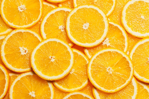 Vista superior do fundo de fatias de frutas cítricas coloridas de laranja