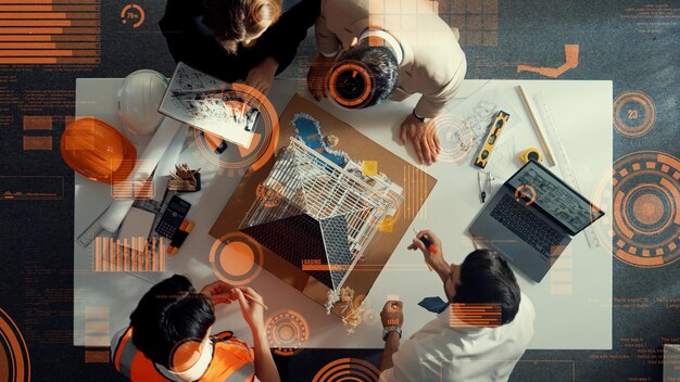 Vista superior del equipo de ingenieros inteligentes que trabajan juntos para diseñar la casa Alimentation