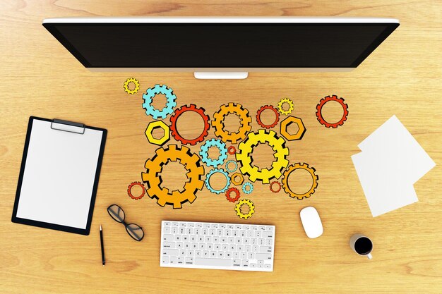 Vista superior del escritorio de madera con monitor de computadora teclado taza de café suministros y colorido boceto de rueda dentada 3D Renderización