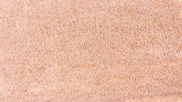 Foto vista superior del fondo de textura de arena fina.