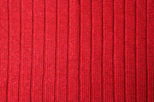 Vista superior del fondo de textura textil abstracto en tonos rojos