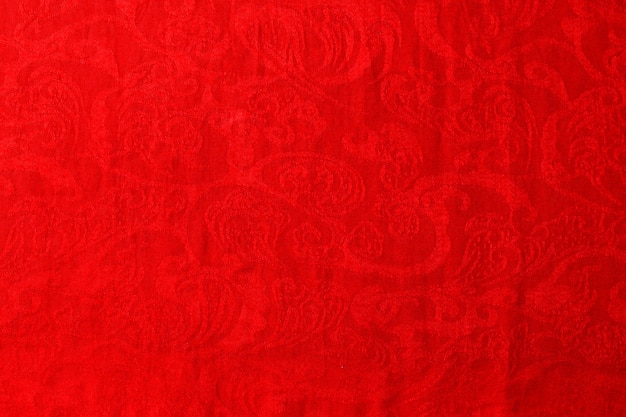 Vista superior del fondo de textura textil abstracto en tonos rojos