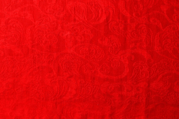 Vista superior del fondo de textura textil abstracto en tonos rojos