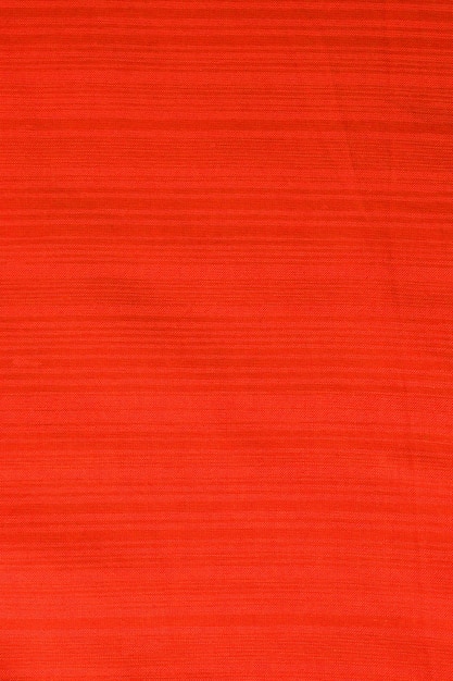 Vista superior del fondo de textura textil abstracto en tonos rojos