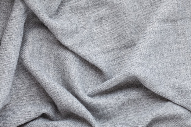 Vista superior sobre textura têxtil cinza de lã macia