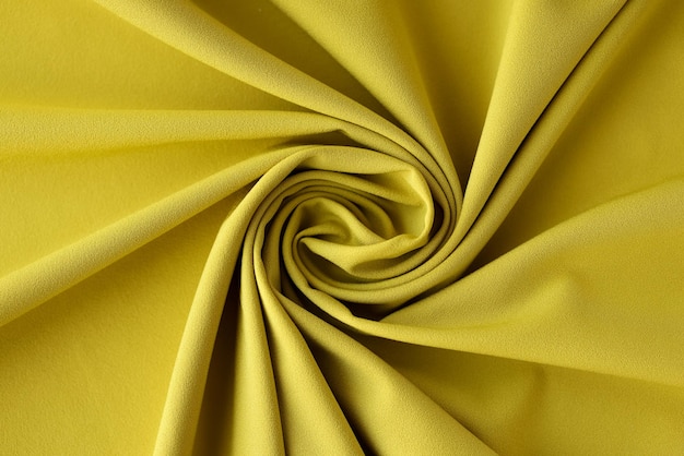 Vista superior de tela de oliva textura de fondo tela textura telón de fondo tela amarilla ondulada mutilada