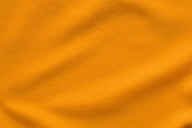 Vista superior de la textura de la camiseta de fútbol de jersey de tela de ropa deportiva color naranja