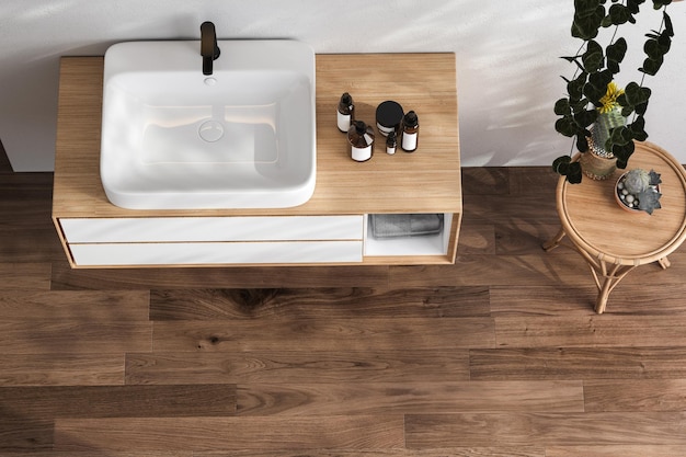 Vista superior de un tocador de madera con lavabo de cerámica blanca y grifo de estilo moderno en un baño