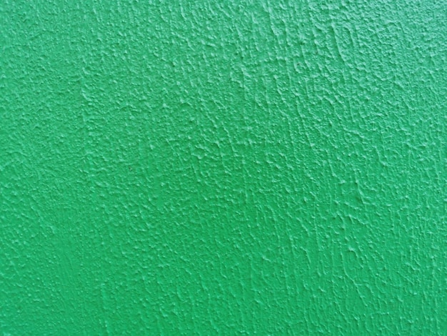 Vista de la textura de la pared con pintura verde.