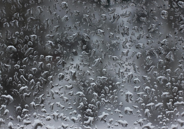 Foto vista de una ventana con gotas de lluvia texturizadas