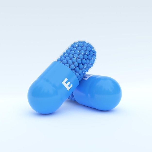 Vitamin E mit blauem Kapselgranulat und weißem Hintergrund