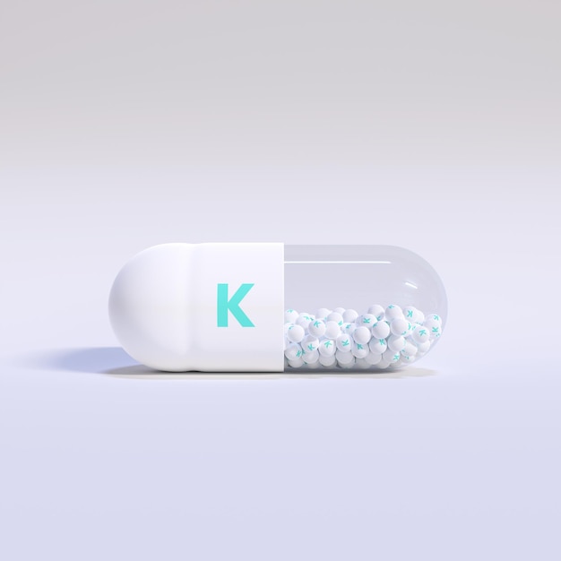 Vitamina K com grânulos de cápsulas brancas e fundo