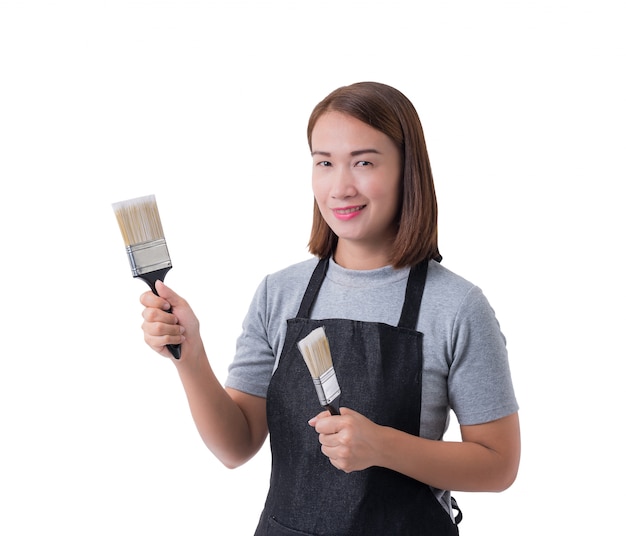 Volles Körperporträt einer Arbeitskraftfrau oder der Servicewoman im grauen Hemd und im Schutzblech hält Pinsel lokalisiert auf weißem Hintergrund