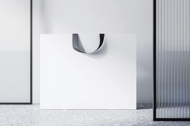 Vorderansicht auf leerer weißer Papiereinkaufstasche mit Platz für Ihren Markennamen oder Text auf hellem Betonboden und hellem Wandhintergrund Nahaufnahme 3D-Rendering-Mockup