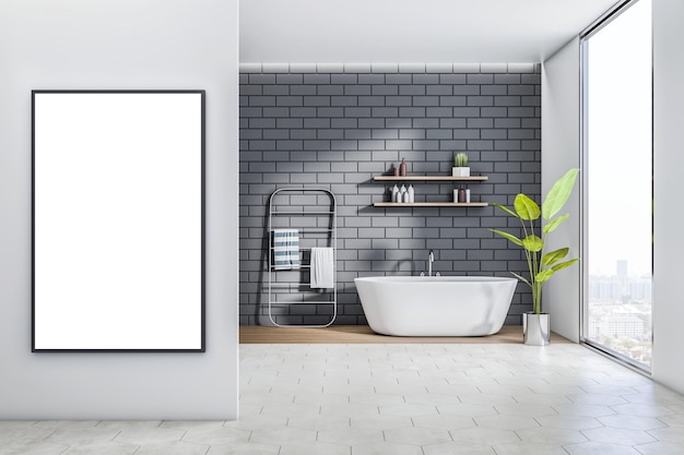 Vorderansicht auf leeres weißes Poster in schwarzem Rahmen an grauer Wand in sonnendurchflutetem, stilvollem Badezimmer mit weißer Badewanne und Handtuchhalter auf grauem Backsteinwandhintergrund und Blick auf die Stadt vom Fenster 3D-Rendering-Mockup