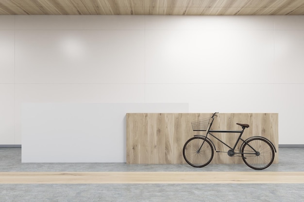 Vorderansicht eines Empfangstresens aus Holz, daneben steht ein Fahrrad. Beton- und Holzboden, weiße Wände. 3D-Rendering. Attrappe, Lehrmodell, Simulation