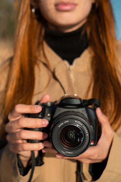 Foto vorderansichtfotograf mit kamera