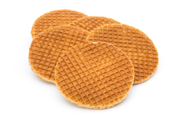 Waffeln mit Karamell auf weißem Grund