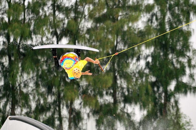 Wake boarding rider jumping