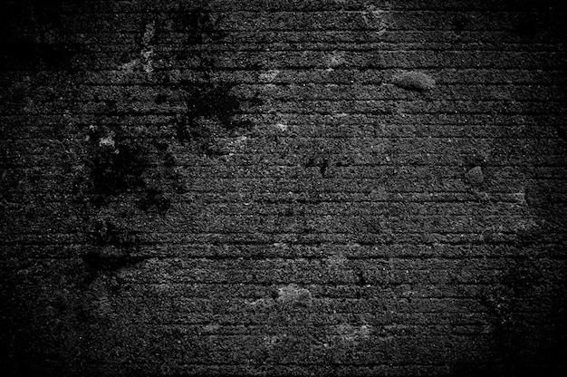 Wand Grunge schwarzer Beton mit hellem Hintergrund. Schmutzige Wand konkrete Tafelstruktur und Spritzer oder abstrakter Hintergrund.