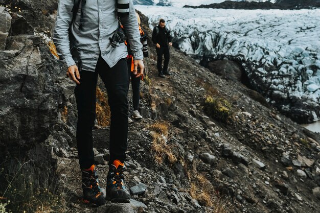 Wanderer am Gletscher Svínafellsjökull, Island