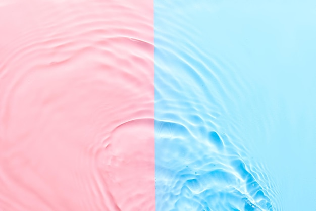 Wasser rosa blaue Oberfläche abstrakter Hintergrund Wellen und Wellen Textur von kosmetischen Aqua Feuchtigkeitscreme mit Blasen