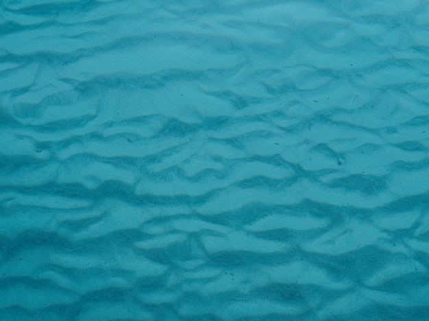 Wasser Sand Textur. Blauer Hintergrund.