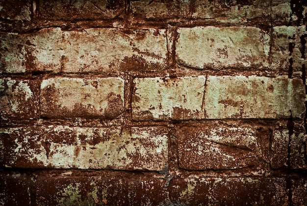 Weathered manchado antigo fundo de parede de tijolo