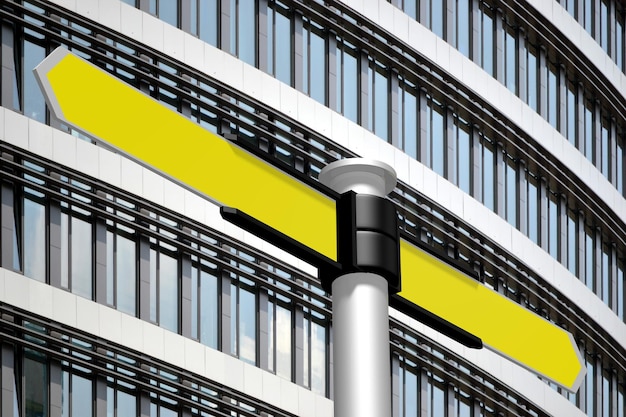 Wegweiser mit gelben Pfeilen Bürogebäude im Hintergrund 3D-Darstellung