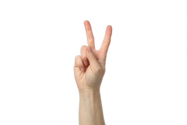 Weibliche Hand, die zwei Finger zeigt, lokalisiert auf weißem Hintergrund
