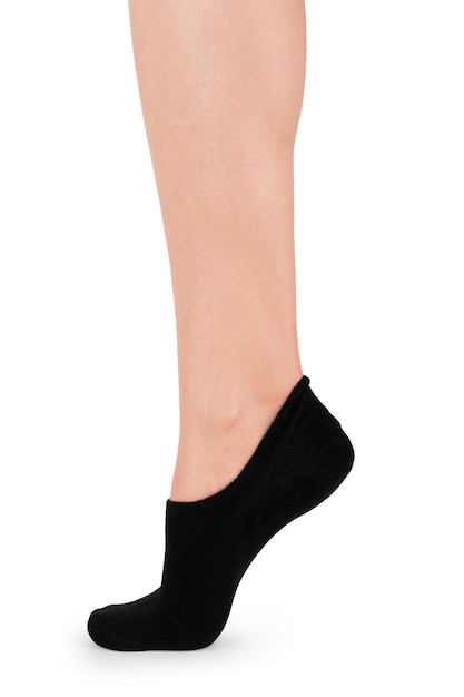 Weibliches Bein in schwarzer Socke auf weißem Hintergrund