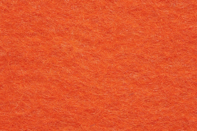 Weicher Filz Textilmaterial leuchtend orange Farben bunte Textur Klappe Stoff Hintergrund Nahaufnahme