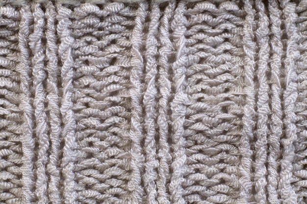 Weiches Licht natürliche Textur aus gestrickter Wolle Textilmaterial Hintergrund Weiße gehäkelte Baumwollgewebe gewebte Leinwand