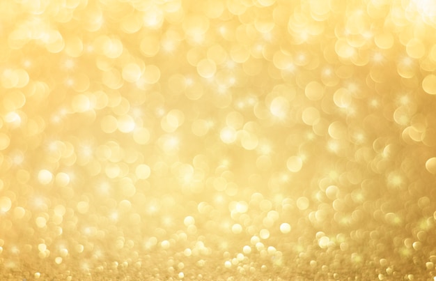 Weihnachten Hintergrund. Goldener Feiertag abstrakter Glitzer-defokussierter Hintergrund