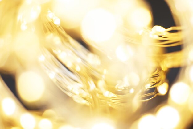 Weihnachten wunderschöner glänzender goldener Hintergrund funkelt festlich verschwommenes Bokeh