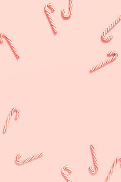 Foto weihnachts-neujahrsgrußkarte mit zuckerstangen auf pastellrosa hintergrund mit kopierraum