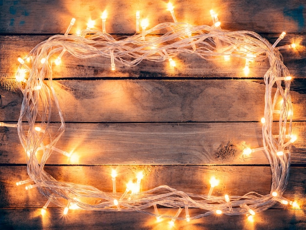 Foto weihnachtsdekoration hintergrund - jahrgang planked holz mit lichter mit kopie raum text.