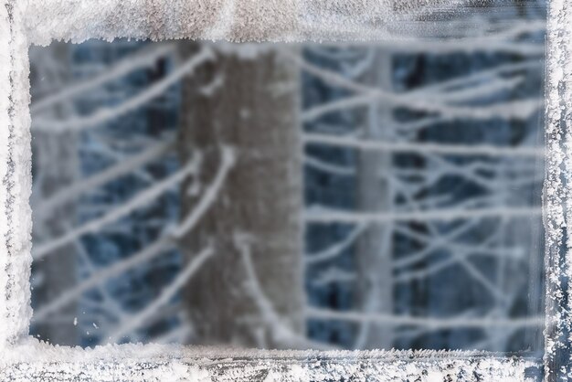 Foto weihnachtshintergrund mit rahmen vom frost