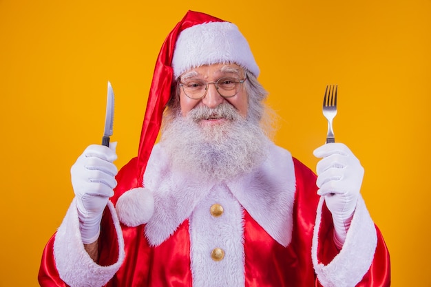 Weihnachtsmann mit Messer und Gabel