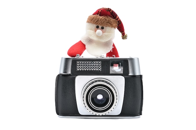 Weihnachtsmann und Weinlesekamera auf weißem lokalisiertem Hintergrund für Neujahr und Weihnachten