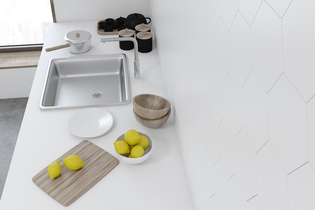 Weiß gefliester Kücheninnenraum mit weißer Arbeitsplatte und eingebauter Spüle. Eine Draufsicht. Konzept von hausgemachtem Essen. 3D-Rendering-Attrappe