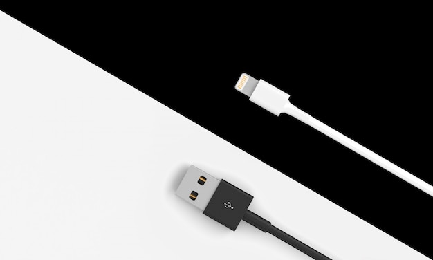 Weiße und schwarze USB-Kabel auf einem zweifarbigen Hintergrund