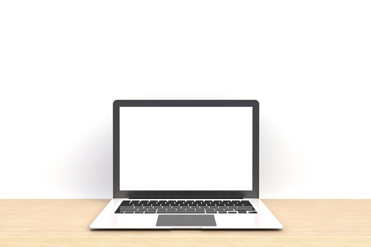 Weißer leerer Bildschirm des Laptop-Computers auf Vorderansicht der Holzarbeittabelle