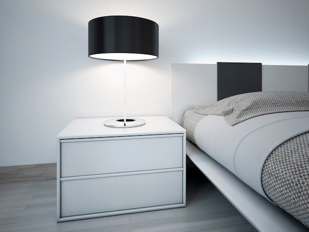 Weißer Nachttisch mit schwarzer Lampenschirmlampe in der Nähe des Bettes im modernen Schlafzimmer.