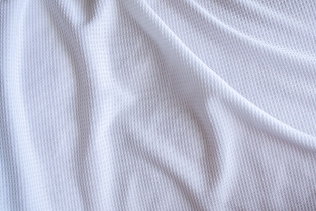 Weißer Sportbekleidungsstoff Fußballhemd Jersey Textur abstrakter Hintergrund