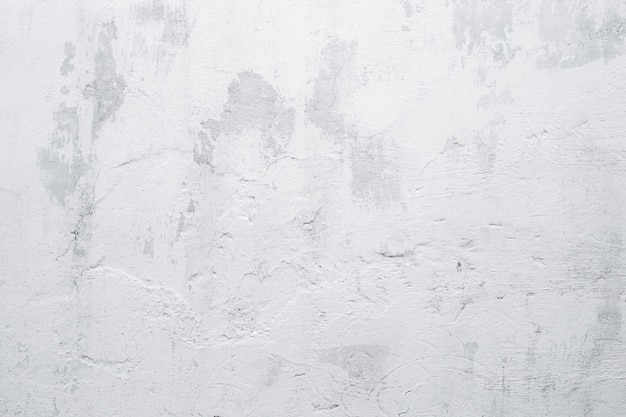 Weißer Wandhintergrund des alten Schmutzes. Textur der gealterten weiß getünchten Wand
