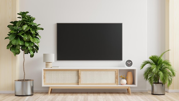 Weißer wandmontierter fernseher auf schrank im wohnzimmerminimaldesign