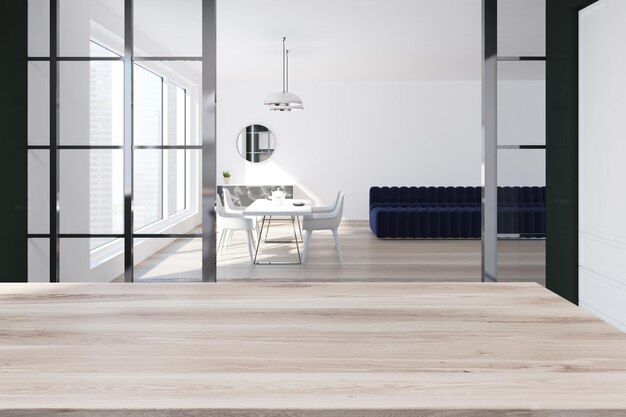 Weißes Esszimmerinterieur mit einem langen blauen Sofa, einem weißen Tisch mit Stühlen und einem Holzboden. 3D-Rendering-Mockup