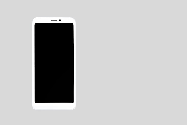weißes Smartphone isoliert auf grau